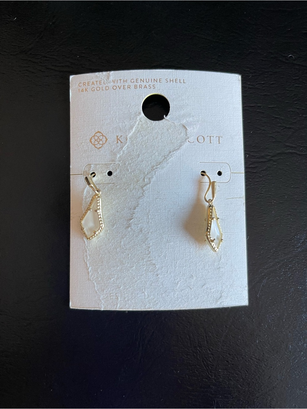 Kendra Scott Gold and mother of pearl Drop Earrings.